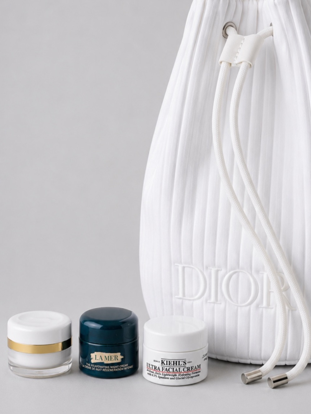 White Dior Cosmetic Bag and Trio of Miniature Face Cream Moisturizer